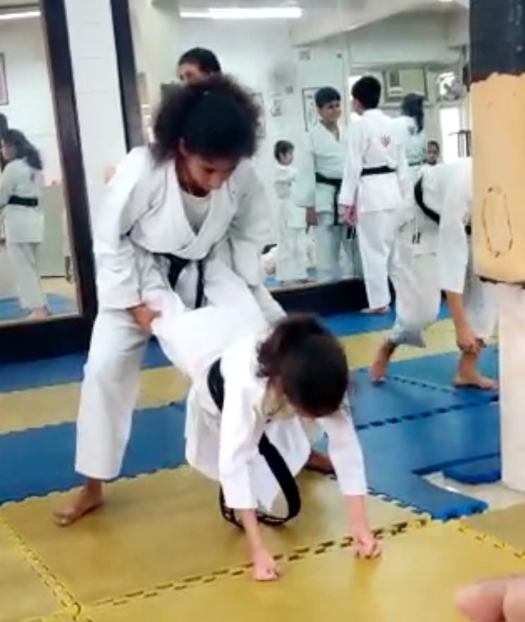 Ariana sparring on the mat during karate training