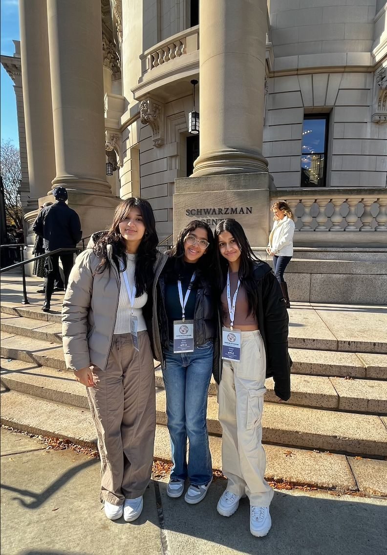 Ariana with two teammates on the steps of the Schwarzman Center at Yale